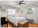 Cozy bedroom with hardwood floors, windows with natural light, ceiling fan and neutral decor at 6698 35Th N Ave, St Petersburg, FL 33710