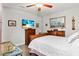 Relaxing bedroom features a ceiling fan, wood floors, and bright natural light at 6698 35Th N Ave, St Petersburg, FL 33710