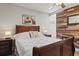 Bright bedroom featuring wood accent wall, ceiling fan, and ample natural light at 6698 35Th N Ave, St Petersburg, FL 33710