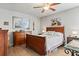 Comfortable bedroom with wood floors, ceiling fan, and traditional furnishings at 6698 35Th N Ave, St Petersburg, FL 33710