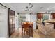 Open dining area with barn door, adjacent to the kitchen and sliding doors to outside at 6698 35Th N Ave, St Petersburg, FL 33710