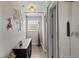 Hallway with decor and tile floors leading to bedrooms at 6698 35Th N Ave, St Petersburg, FL 33710