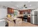 Updated kitchen boasts granite counters, wood cabinets, and stainless steel appliances at 6698 35Th N Ave, St Petersburg, FL 33710
