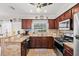 Renovated kitchen with stone counters, stainless steel appliances, and ample counter space at 6698 35Th N Ave, St Petersburg, FL 33710
