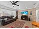 Cozy living room featuring wood-look flooring, a decorative fireplace, and a comfortable sofa at 6698 35Th N Ave, St Petersburg, FL 33710
