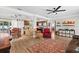 Open-concept space with wood-look flooring, neutral colors, and views into the kitchen and dining areas at 6698 35Th N Ave, St Petersburg, FL 33710