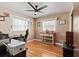 Office space with two windows, hardwood flooring and a ceiling fan for comfortable work at 6698 35Th N Ave, St Petersburg, FL 33710