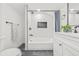 Bathroom features modern fixtures, stylish tile, and a combined tub and shower at 7 Hamilton Heath Dr, Tampa, FL 33604