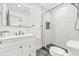 Updated bathroom featuring a modern vanity and a shower with stylish herringbone tile at 7 Hamilton Heath Dr, Tampa, FL 33604