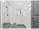 Updated bathroom with shower, modern vanity, and black floor tiles at 7 Hamilton Heath Dr, Tampa, FL 33604