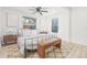 Bedroom with ceiling fan, hardwood floors, and two side tables at 7 Hamilton Heath Dr, Tampa, FL 33604