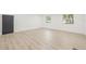 A bright room with wood flooring, fresh paint, and an ample amount of sunlight at 7 Hamilton Heath Dr, Tampa, FL 33604