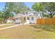 Inviting curb appeal with a well-maintained front yard, modern porch, and freshly painted exterior at 7 Hamilton Heath Dr, Tampa, FL 33604