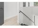 Bright hallway with updated floors and modern railing at 7 Hamilton Heath Dr, Tampa, FL 33604