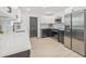 Modern kitchen featuring stainless steel appliances, sleek counter tops, modern backsplash and contrasting cabinetry at 7 Hamilton Heath Dr, Tampa, FL 33604