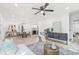 Open-concept home showcasing seamless transitions from living to dining to kitchen areas with hardwood floors and modern decor at 7 Hamilton Heath Dr, Tampa, FL 33604
