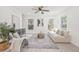 Inviting living room with a comfortable couch and chair, neutral tones and plenty of natural light at 7 Hamilton Heath Dr, Tampa, FL 33604