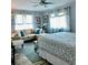 Spacious bedroom boasts a ceiling fan and natural light at 7200 Sunshine Skyway S Ln # 2E, St Petersburg, FL 33711