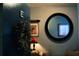 Charming entryway featuring a decorative mirror, side table and elegant accent decorations at 7200 Sunshine Skyway S Ln # 2E, St Petersburg, FL 33711