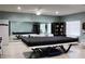 Game room featuring a billiards table, seating, and bookshelves at 7200 Sunshine Skyway S Ln # 2E, St Petersburg, FL 33711