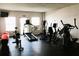 Community gym features modern workout equipment and natural light at 7200 Sunshine Skyway S Ln # 2E, St Petersburg, FL 33711
