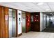 Condo hallway with elevators and emergency phones at 7200 Sunshine Skyway S Ln # 2E, St Petersburg, FL 33711