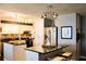 Updated kitchen with white cabinets, stainless steel appliances, and granite countertops at 7200 Sunshine Skyway S Ln # 2E, St Petersburg, FL 33711