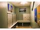Indoor mailboxes with adjacent bench are conveniently located in the building's foyer at 7200 Sunshine Skyway S Ln # 2E, St Petersburg, FL 33711