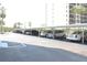 Condo parking area with assigned covered parking spaces at 7200 Sunshine Skyway S Ln # 2E, St Petersburg, FL 33711