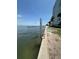 Waterfront condo with a lift to help people into the water on a sunny day at 7200 Sunshine Skyway S Ln # 2E, St Petersburg, FL 33711