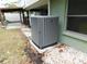 The AC unit sitting outside of the home next to a window at 888 Forest Glen Rd, Clearwater, FL 33765