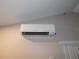 Wall mounted AC unit on the wall at 888 Forest Glen Rd, Clearwater, FL 33765