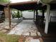 View of backyard featuring decorative rock and wood flooring on patio and other elements at 888 Forest Glen Rd, Clearwater, FL 33765