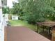 Enjoy the large backyard with a deck, a separate storage shed, and mature trees offering plenty of shade at 888 Forest Glen Rd, Clearwater, FL 33765