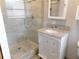 Modern bathroom with new vanity and glass shower doors at 888 Forest Glen Rd, Clearwater, FL 33765