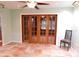 Dining area features tile floors, sliding glass doors, and modern lighting at 888 Forest Glen Rd, Clearwater, FL 33765