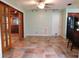 Dining area features tile floors, sliding glass doors, and modern lighting at 888 Forest Glen Rd, Clearwater, FL 33765