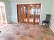 Dining area features tile floors, sliding glass doors, and modern lighting at 888 Forest Glen Rd, Clearwater, FL 33765