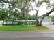 Charming single-Gathering home with mature trees and lush green lawn on a quiet street at 888 Forest Glen Rd, Clearwater, FL 33765