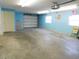 Spacious garage with concrete floor and a white garage door at 888 Forest Glen Rd, Clearwater, FL 33765