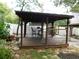 This custom gazebo has a partially covered area with barstool seating for outdoor enjoyment at 888 Forest Glen Rd, Clearwater, FL 33765