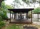 The exterior has a custom gazebo with seating and custom lighting for outdoor entertaining at 888 Forest Glen Rd, Clearwater, FL 33765