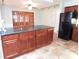 Beautiful kitchen with granite countertops, custom cabinets and stainless steel appliances at 888 Forest Glen Rd, Clearwater, FL 33765