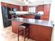 Beautiful kitchen with granite countertops, custom cabinets and stainless steel appliances at 888 Forest Glen Rd, Clearwater, FL 33765