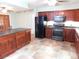 Beautiful kitchen with granite countertops, custom cabinets and stainless steel appliances at 888 Forest Glen Rd, Clearwater, FL 33765