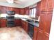 Beautiful kitchen with granite countertops, custom cabinets and stainless steel appliances at 888 Forest Glen Rd, Clearwater, FL 33765