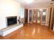 Living room featuring hardwood floors, a fireplace, and natural lighting at 888 Forest Glen Rd, Clearwater, FL 33765