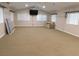 An extra large living room with carpet, sofa and vaulted ceilings at 888 Forest Glen Rd, Clearwater, FL 33765
