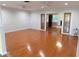 Spacious living room features hardwood floors and decorative glass doors to a second room at 888 Forest Glen Rd, Clearwater, FL 33765