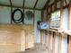 View of the interior of the shed with plywood and other accessories at 888 Forest Glen Rd, Clearwater, FL 33765